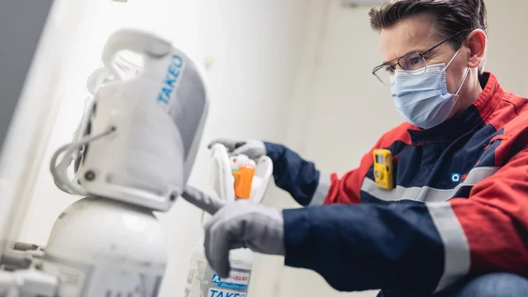 Technician replacing a cylinder 6