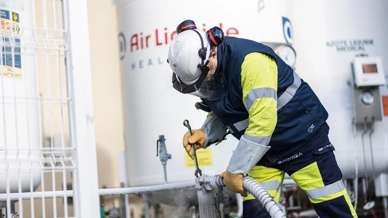 Technician filling a tank 02